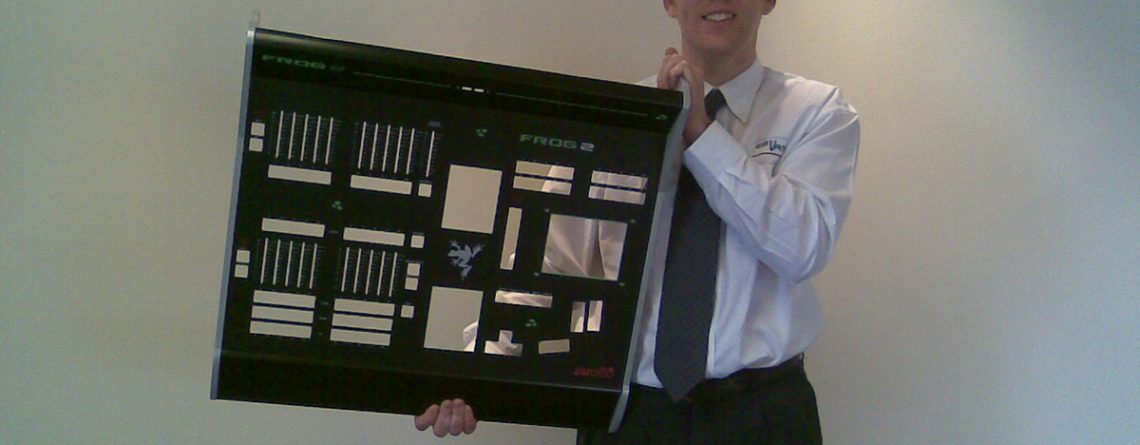 Staff photo of Paul holding large sheet metal fabricated part