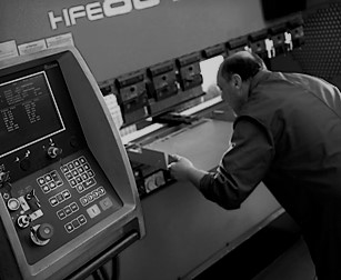 black and white image of man cnc folding